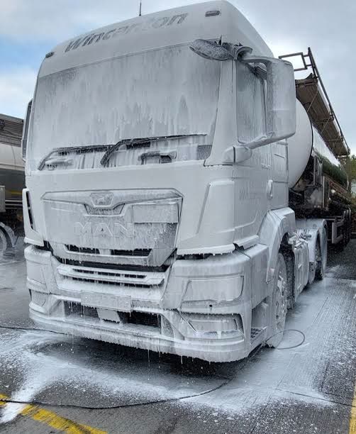 Clean white truck in a Sydney truck wash bay